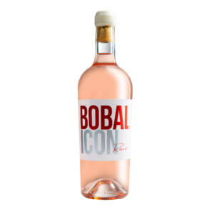 Botella de vino rosado Bobal Icon con etiqueta blanca y texto rojo, destacando un diseño moderno y elegante con tapón de corcho, ideal para ocasiones especiales y certificado de calidad.